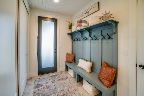 Simple yet elegant bench in the mudroom Beautifully staged space in new home coat hook photos stock pictures, royalty-free photos & images