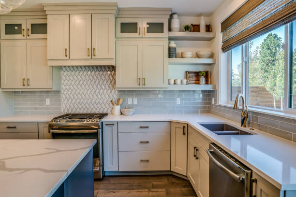 istock Quartz countertop and white cabinets in new kitchen 1348834295