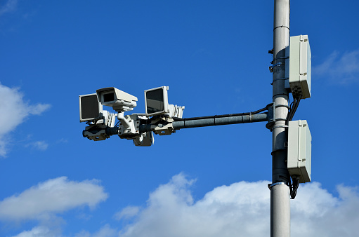 a camera system monitoring the speed of traffic vehicles on the city motorway ring. the fine comes by mail to anyone who exceeds the speed limit. two cameras in two directions