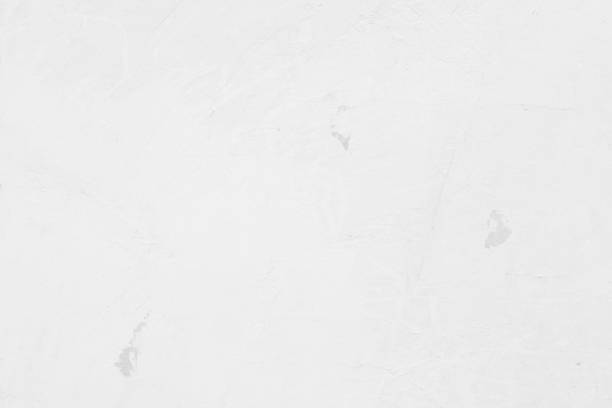 istock White concrete stone surface paint wall background, Grunge cement paint texture backdrop, White rough concrete stone wall background, Copy space for interior design background, banner, wallpaper 1348837006
