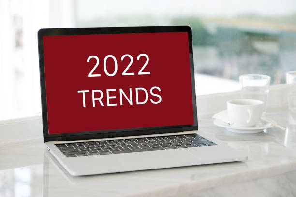 istock 2022 trends on laptop computer screen background, business plan and technology concept 1348837825