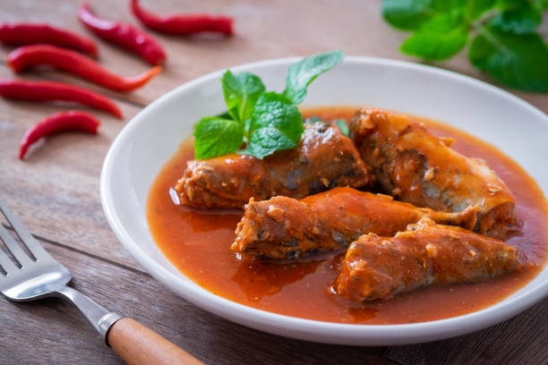 istock Canned fish in tomato sauce on plate 1348837899