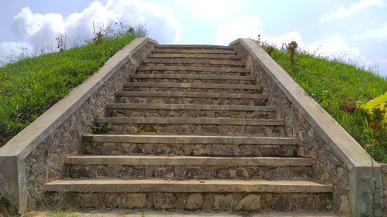 Photo of a staircase leading to the top of a hill in the Cikancung area, Indonesia