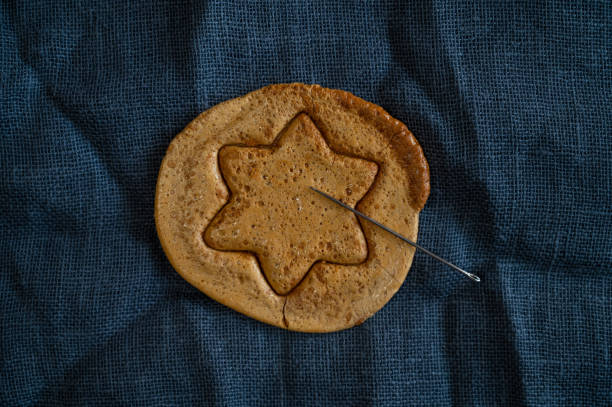 istock Brown sugar caramel candy cookies with a metal needle 1348839903