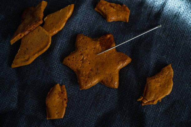 istock Broken Brown sugar caramel candy cookies with a metal needle 1348839969