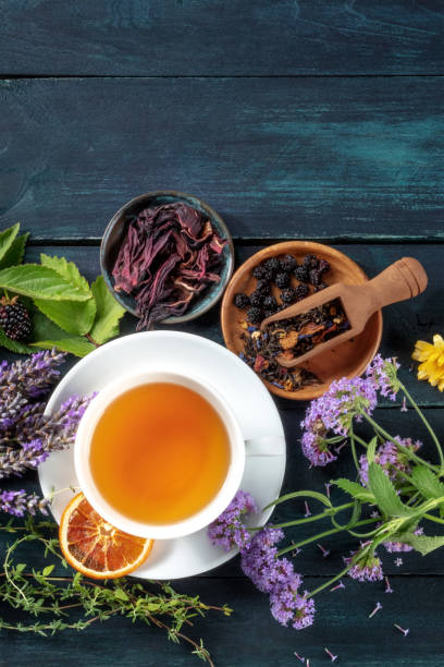 istock Herbal tea, top shot with a place for text. Herbs, flowers and fruit 1348841236