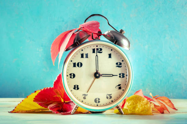 istock Daylight Saving Time concept, fall back in autumn. A vintage alarm clock 1348841302