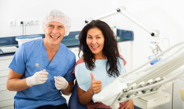 istock Satisfied patient visiting dentist giving thumbs up 1348843933