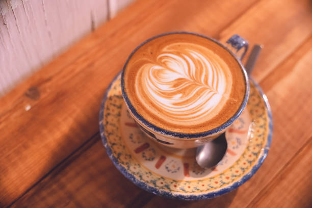 istock Cappuccino in a cute cup at a cafe. 1348845014