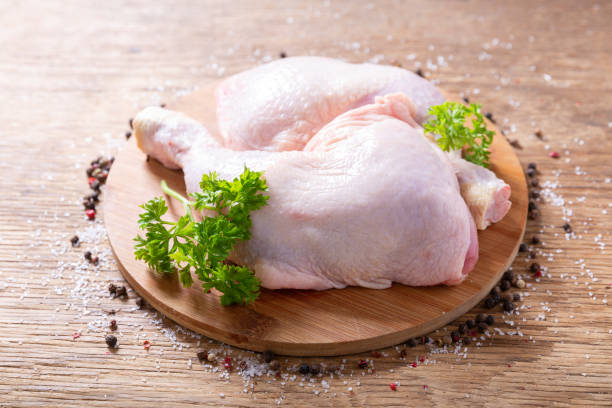 istock fresh chicken legs with parsley and spices 1348848647