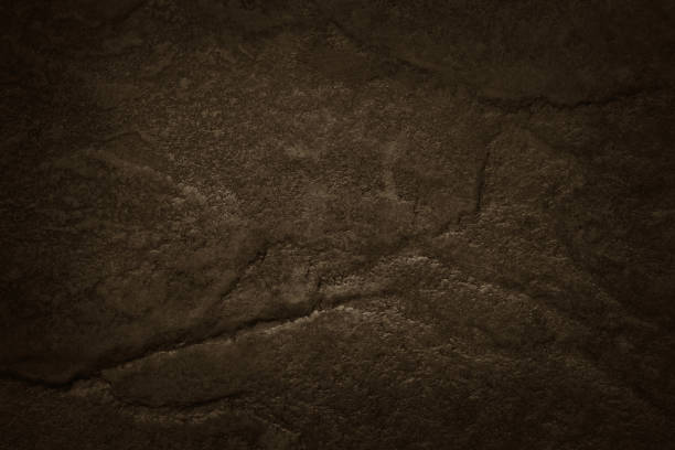 istock Dark brown slate stone wall texture background in natural pattern for decorative interior and exterior. 1348848934