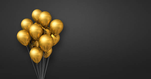 istock Gold balloons bunch on a black wall background. Horizontal banner. 1348850444