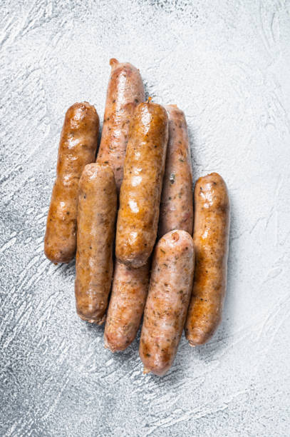 istock Roasted Bratwurst Hot Dog sausages. White background. Top View 1348850557