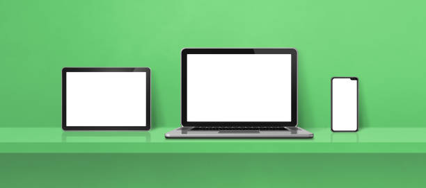 istock Laptop, mobile phone and digital tablet pc on green wall shelf. Banner background 1348851607