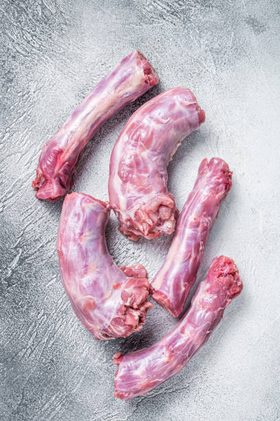 istock Raw Turkey neck meat on a butcher table. White background. Top View 1348851747