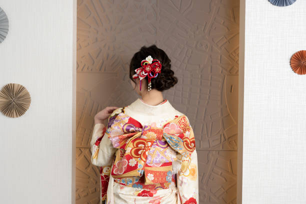 istock A woman in a kimono with her hand on her left shoulder 1348852295