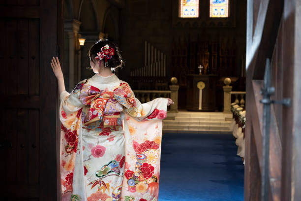 A woman spreading the furisode in a chapel It was taken in the pre-shooting of the coming-of-age ceremony. kimono photos stock pictures, royalty-free photos & images