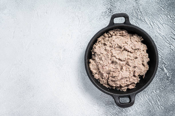istock Duck Rillettes de Canard in a pan. White background. Top View.  Copy space 1348853158