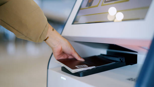 istock Tourist using self check-in kiosk in airport 1348853485