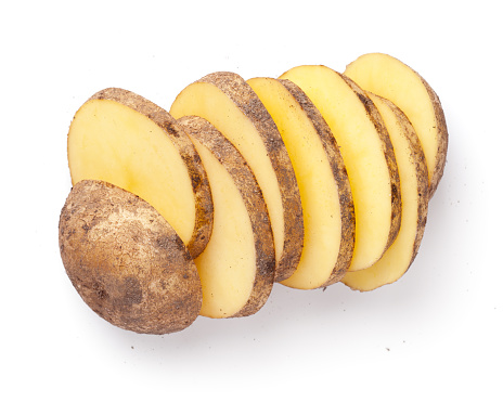 Sliced organic potato isolated on white background. View from above