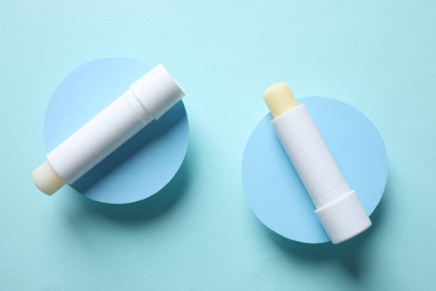 istock Hygienic lipsticks on turquoise background, flat lay 1348856204