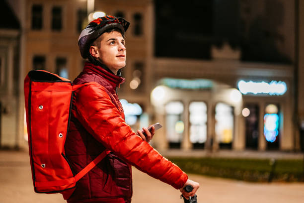 istock Delivery man checking the right address on his phone 1348856258