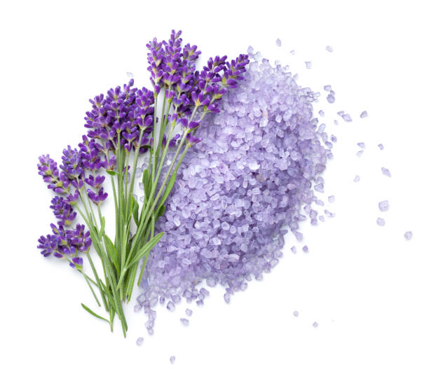 Lavender Flowers And Salt Isolated On White Lavender flowers and salt isolated on white background. Top view bath salt stock pictures, royalty-free photos & images