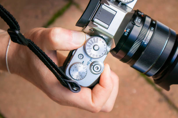 istock Closeup of a hand using a vintage camera SLR 1348856937
