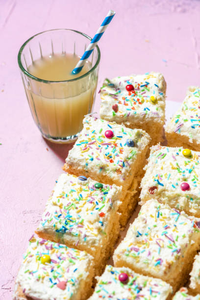 istock Colorful Cream Cake on Pink Table 1348858213