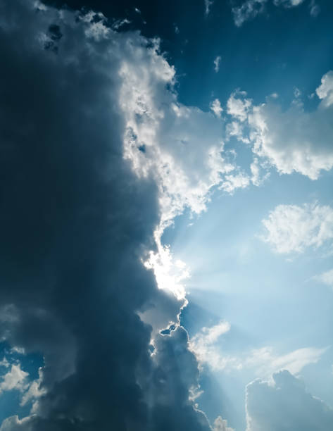 istock The sun breaks through the beautiful clouds 1348861219