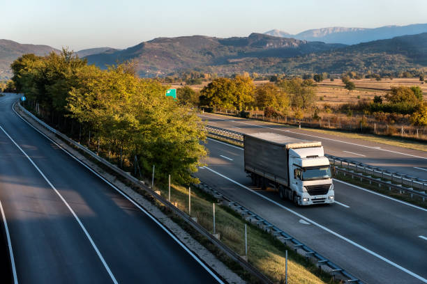 istock Big powerful truck on highway 1348861236