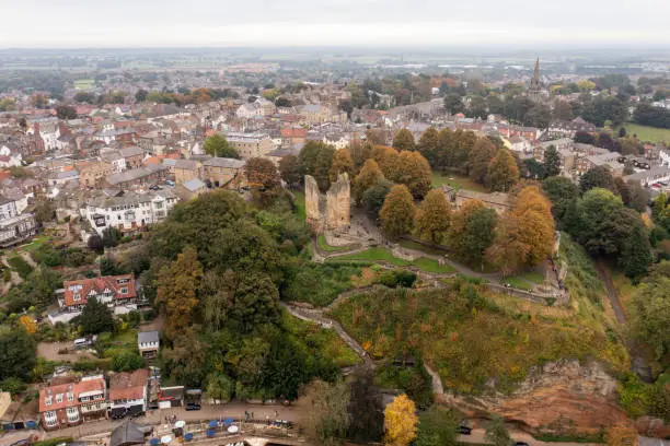 Photo of Aerial drone photo of the beautiful village of Knaresborough in North Yorkshire in the winter time showing the ruins of the famous Knaresborough Castle along side trees