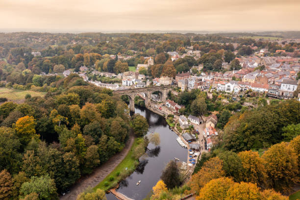 Aerial drone photo of the beautiful village of Knaresborough in North Yorkshire in the winter time showing the famous Knaresborough Viaduct and train tracks and the River Nidd stock photo