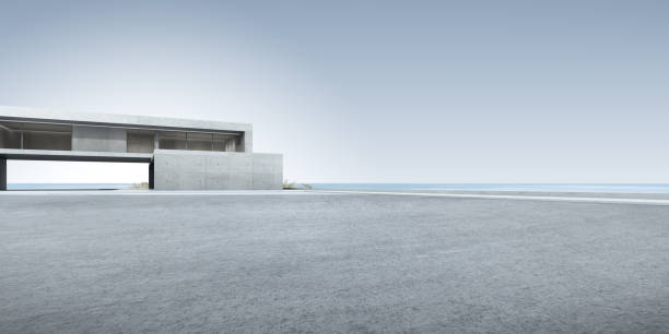 istock 3d render of futuristic concrete architecture with car park, empty cement floor. 1348861772