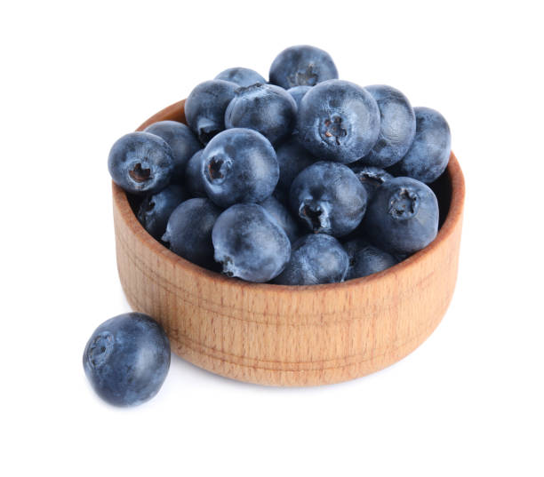 istock Fresh ripe blueberries in bowl on white background 1348863776