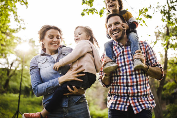 istock Happy parents having fun with their kids in nature. 1348865520