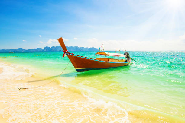 Long boat and sunny landscape in Krabi provinces, Tailand Long boat and sunny blue sky in Krabi provinces, Thailand, travel photo koh poda stock pictures, royalty-free photos & images