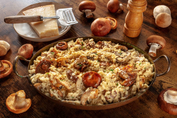 istock Risotto ai funghi, mushroom risotto, rustic rice with mushrooms and cheese 1348867509