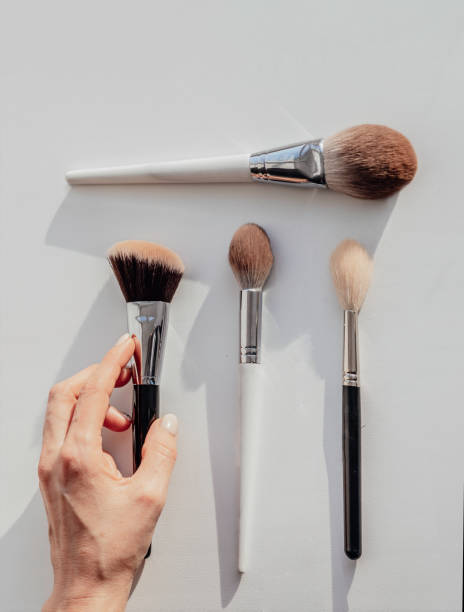 istock Woman holds brush for professional makeup. brushes set 1348869665