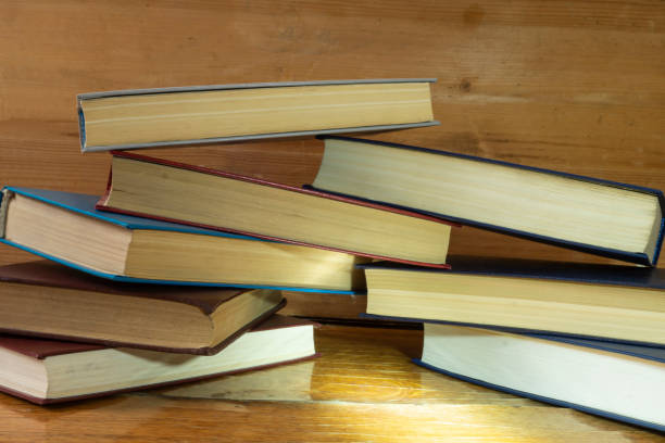 istock The Stack of the books rests upon wooden regiment 1348869686
