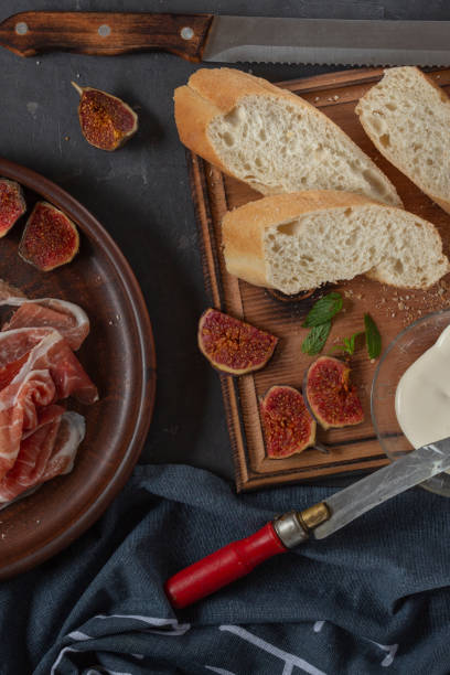 istock Jamon with figs and a baguette with cream cheese 1348869933