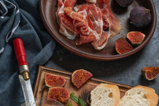 istock Jamon with figs and a baguette with cream cheese 1348870022
