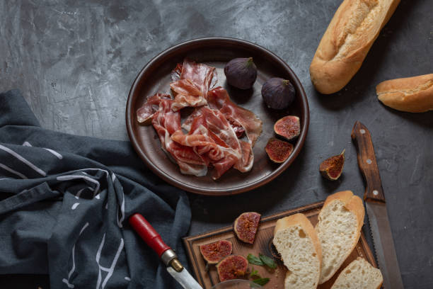 istock Jamon with figs and a baguette with cream cheese 1348870115