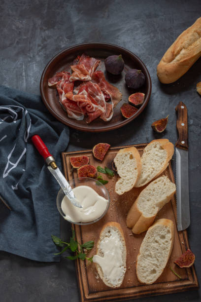 istock Jamon with figs and a baguette with cream cheese 1348870116