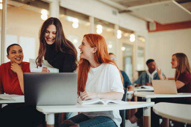 university students in classroom after lecture - college student high school student education learning imagens e fotografias de stock