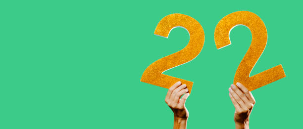 istock holds number 22 in his hands, web banner 1348870288