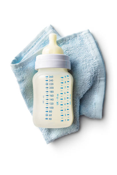 Baby Goods: Milk Bottle and Napkin Isolated on White Background