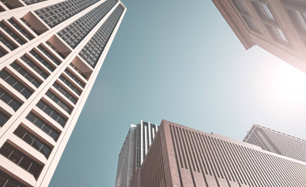 istock Looking up at New York skyscrapers, color toning applied, US. 1348871336