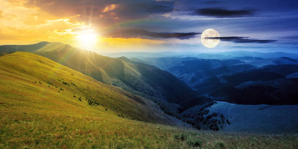 istock day and night time change above mountain landscape 1348872440