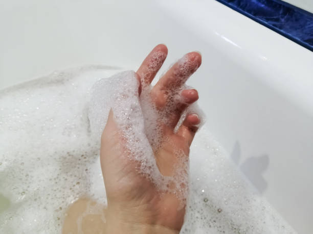istock Bath, a woman's hand in a lush foam 1348872747